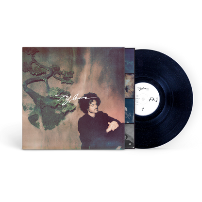 Vinyl record with cover featuring a person and nature design, brand 'Tyber' visible.